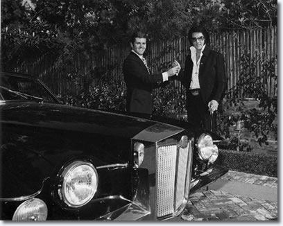 Elvis takes delivery of his 1971 Stutz Blackhawk from Jules Meyers 1971