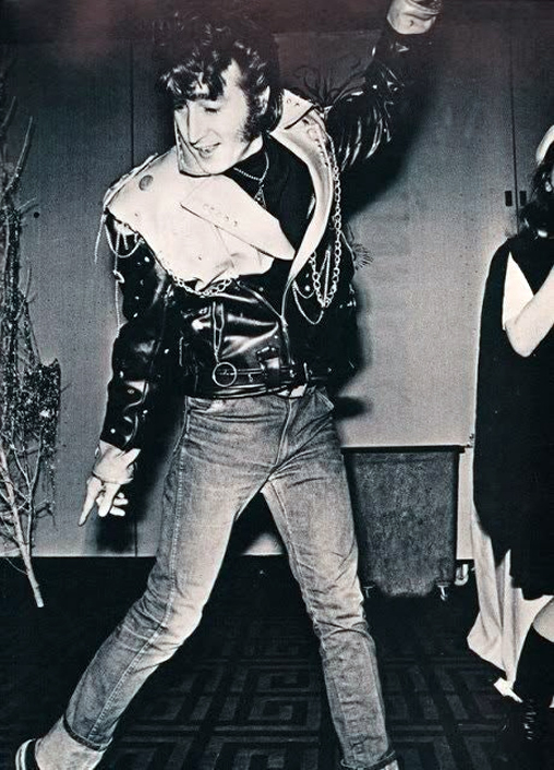 John Lennon came as Elvis Presley - or at least a lookalike - with greased-up hair and wearing a leather jacket and jeans.